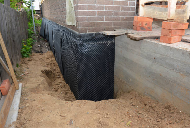 SJ Waterproofing Pros technician performing targeted Waterproofing assessment in Parker City, IN